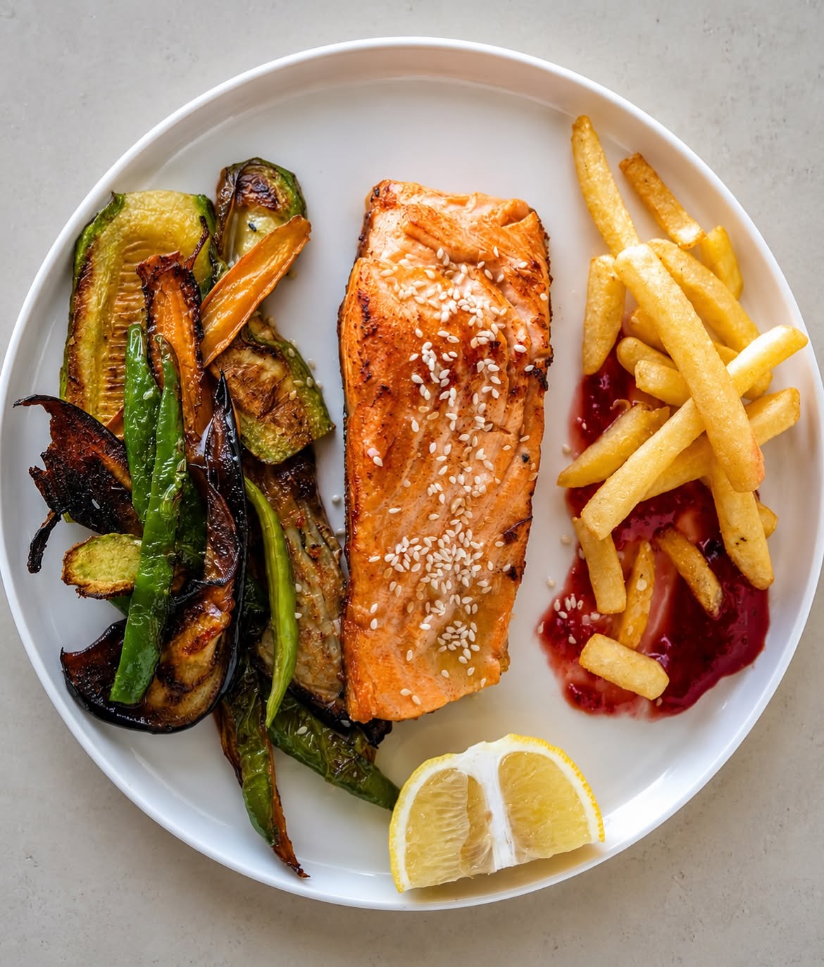 Grilled salmon with vegetables and fries at Ujvara Restaurant